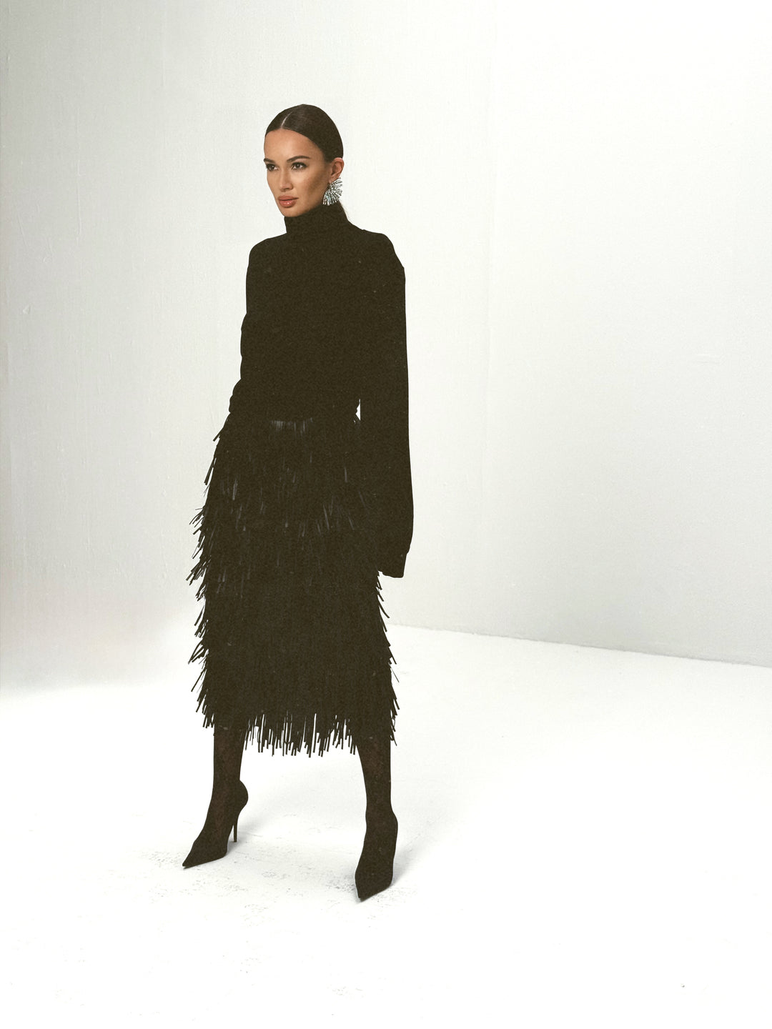 Noir wool-viscose draped turtleneck sweater