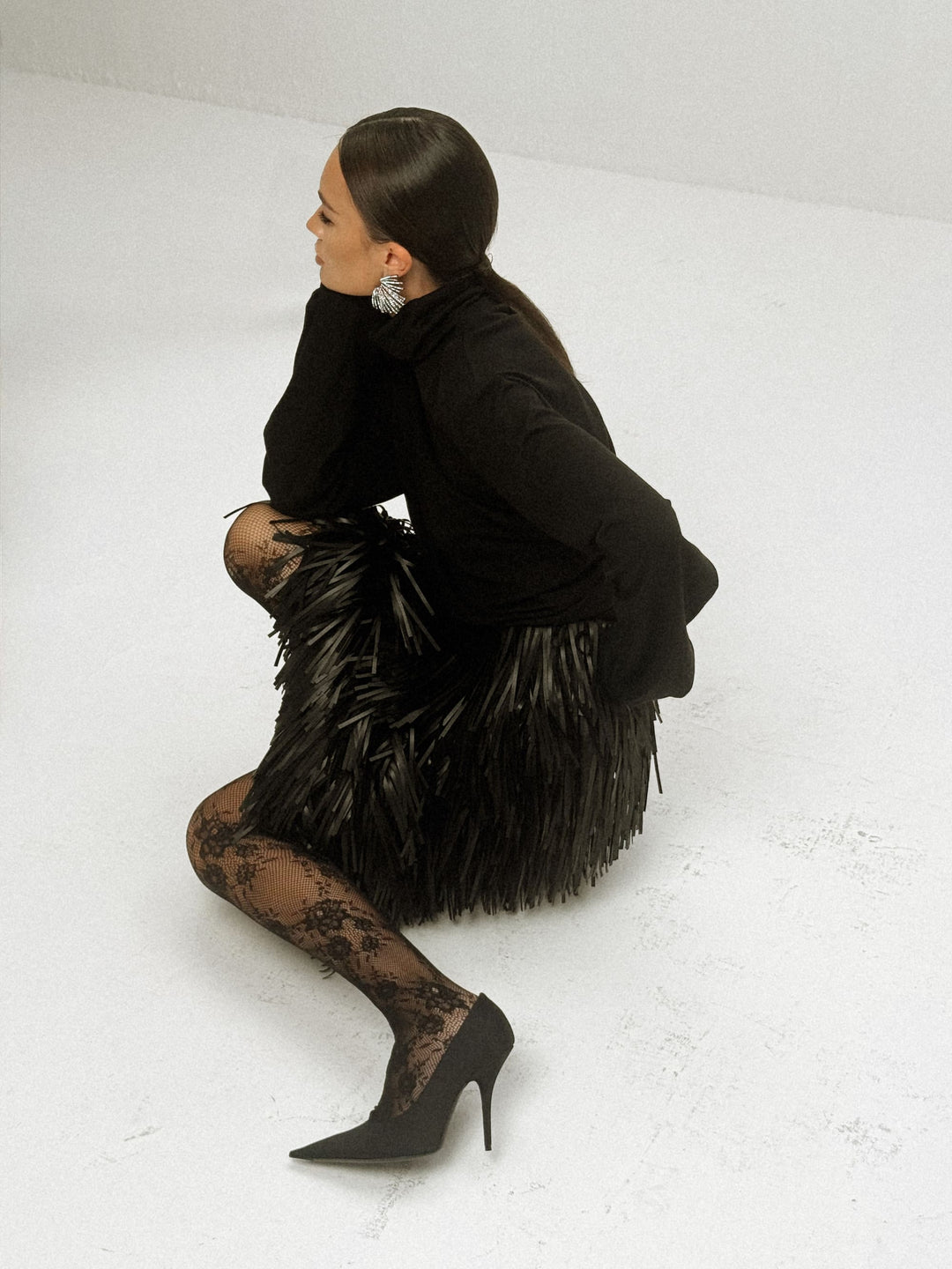 Noir wool-viscose draped turtleneck sweater