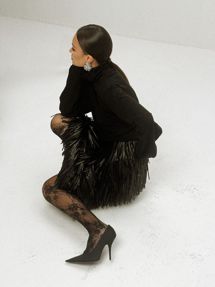Noir wool-viscose draped turtleneck sweater